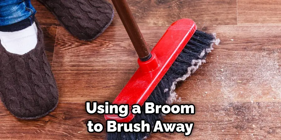 Using a Broom to Brush Away