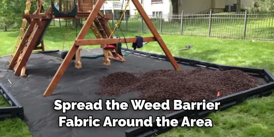 Spread the Weed Barrier Fabric Around the Area 