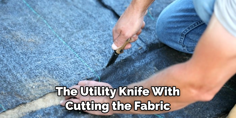 The Utility Knife With Cutting the Fabric
