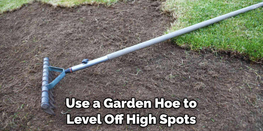 Use a Garden Hoe to Level Off High Spots