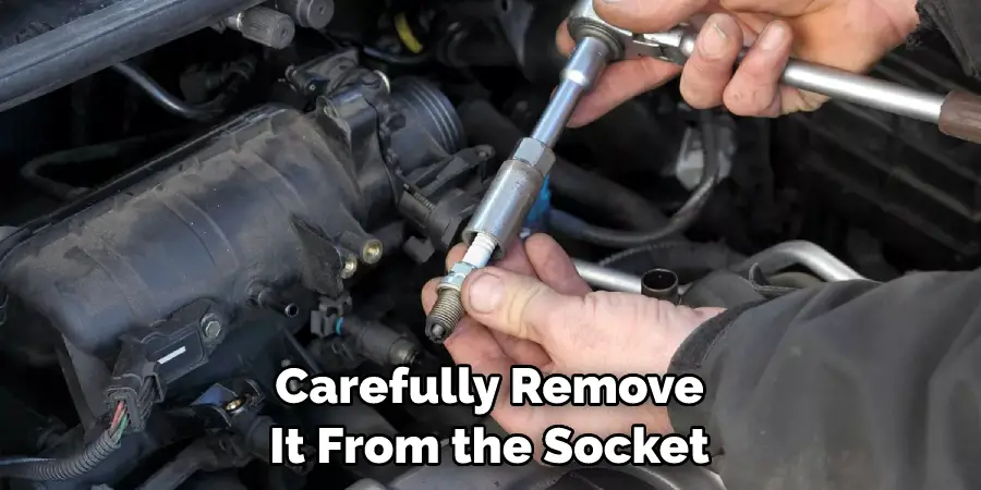 Carefully Remove It From the Socket