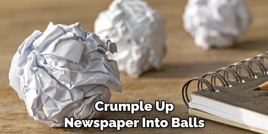 Crumple Up Newspaper Into Balls