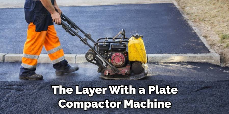The Layer With a Plate Compactor Machine