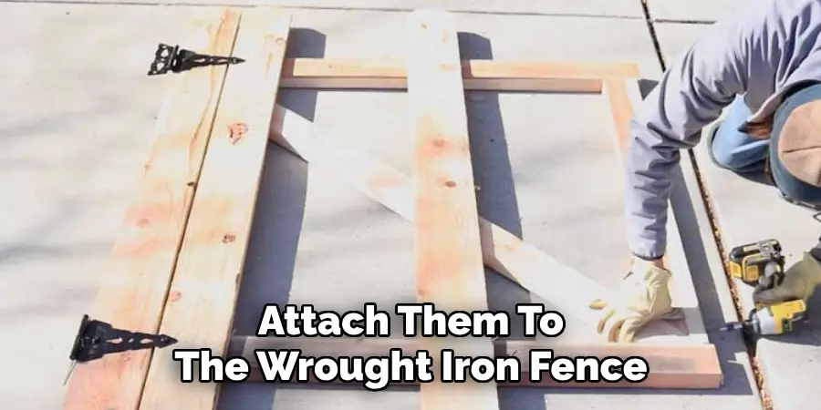 Attach Them To The Wrought Iron Fence