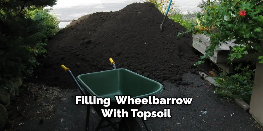 Filling Your Wheelbarrow  With Topsoil