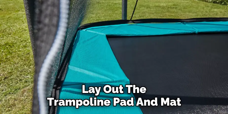 Lay Out The Trampoline Pad And Mat