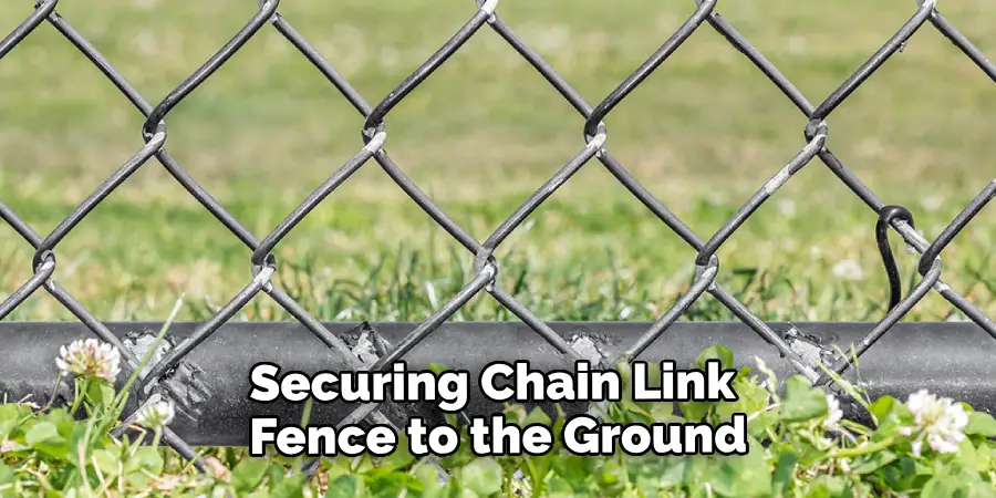 Securing a Chain Link Fence to the Ground