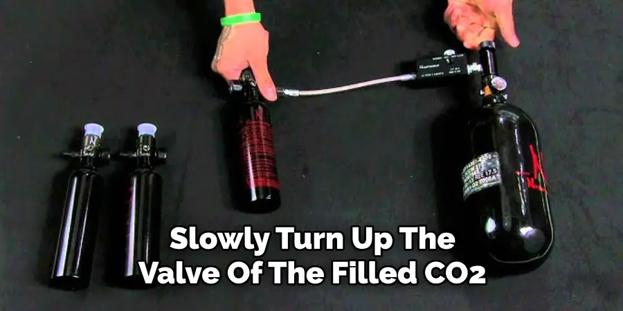 Slowly Turn Up The Valve Of The Filled CO2