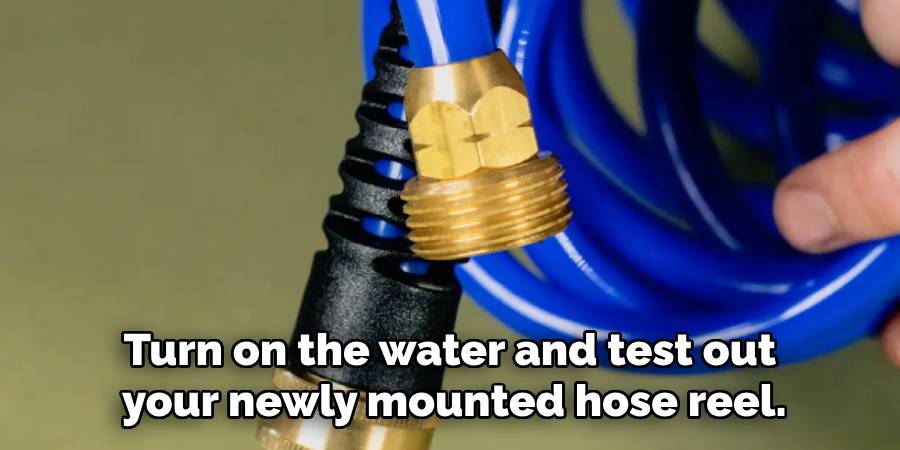 Turn on the water and test out your newly mounted hose reel.
