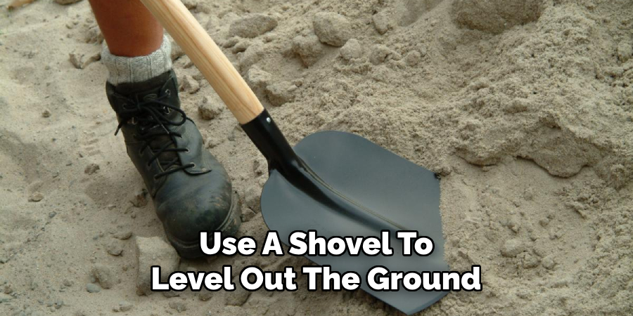 Use A Shovel To Level Out The Ground
