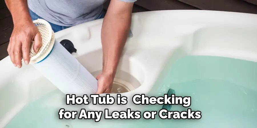 Hot Tub is Checking for Any Leaks or Cracks