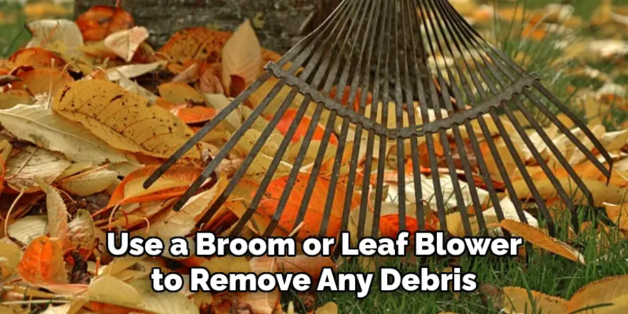  Use a Broom or Leaf Blower to Remove Any Debris