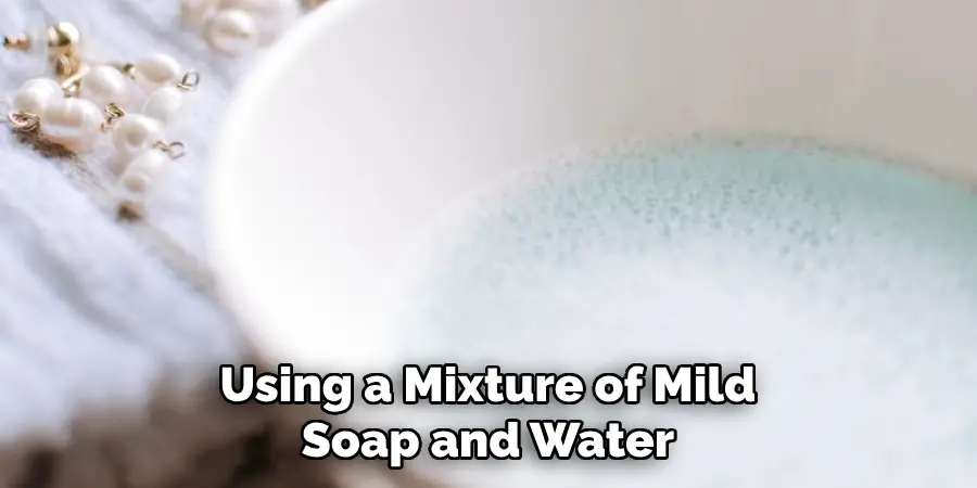 Using a Mixture of Mild Soap and Water
