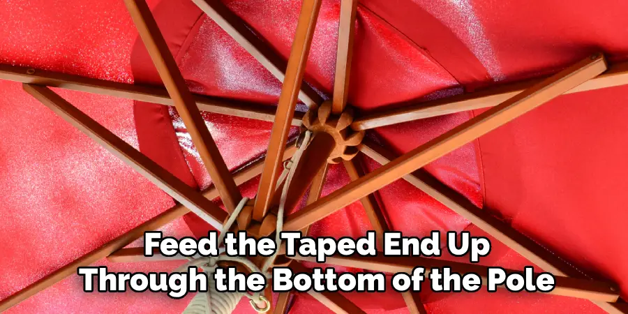 Feed the Taped End Up
Through the Bottom of the Pole