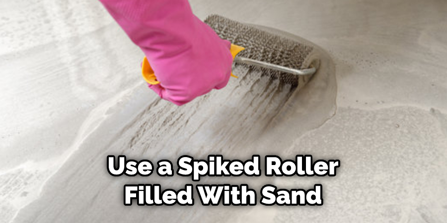 Use a Spiked Roller Filled With Sand