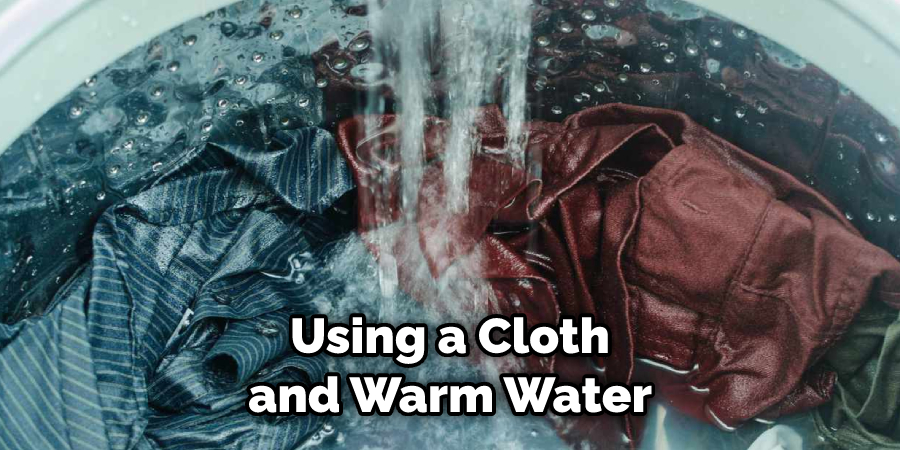 Using a Cloth and Warm Water