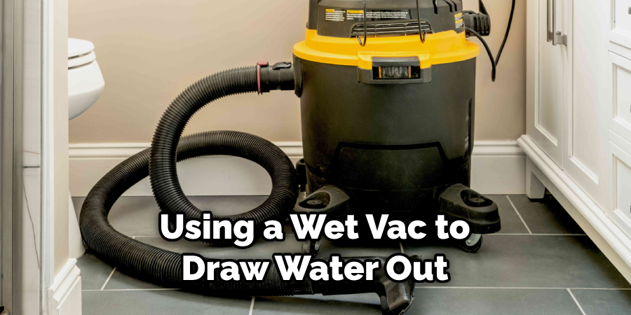 Using a Wet Vac to Draw Water Out